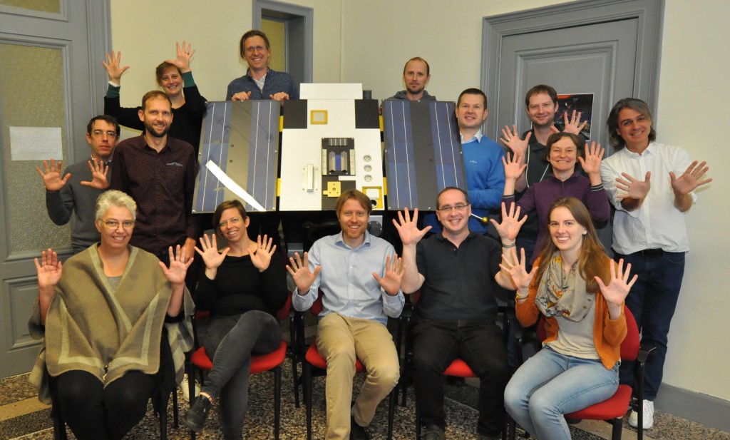 Photo of the PROBA2 team with a maquette of PROBA2