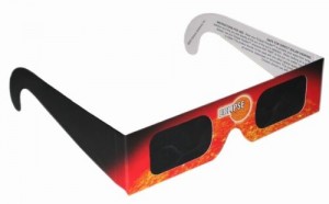 A pair of eclipse glasses in red and black.