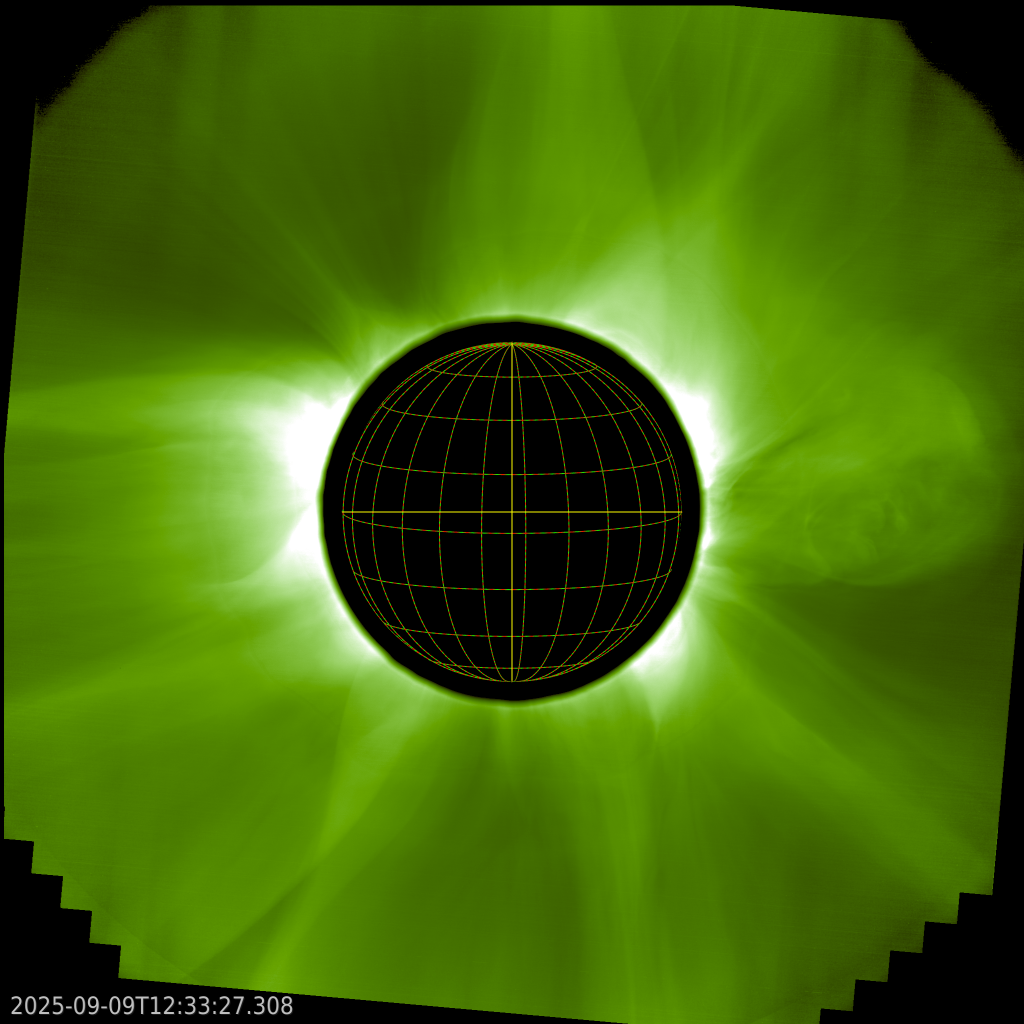 Black disk surrounded by a greenish solar corona